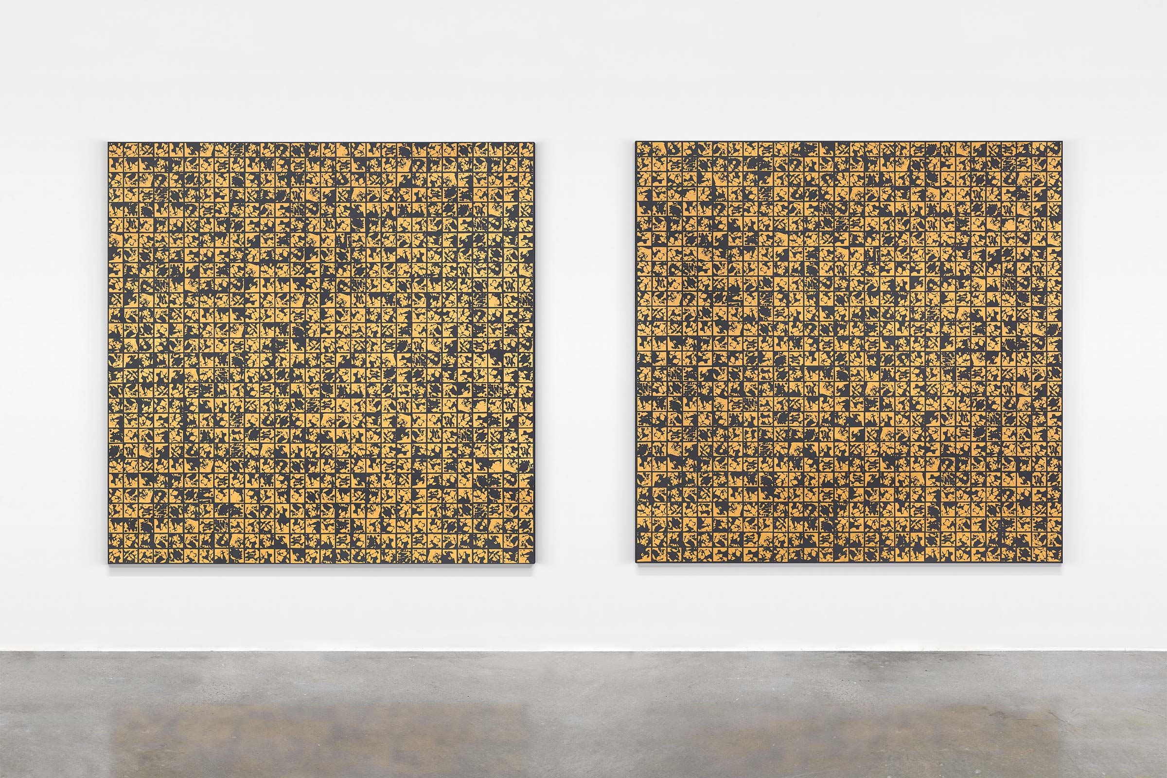 Artwork documentation of two large paintings made with gold and black patterns installed on a white wall of an art gallery.
