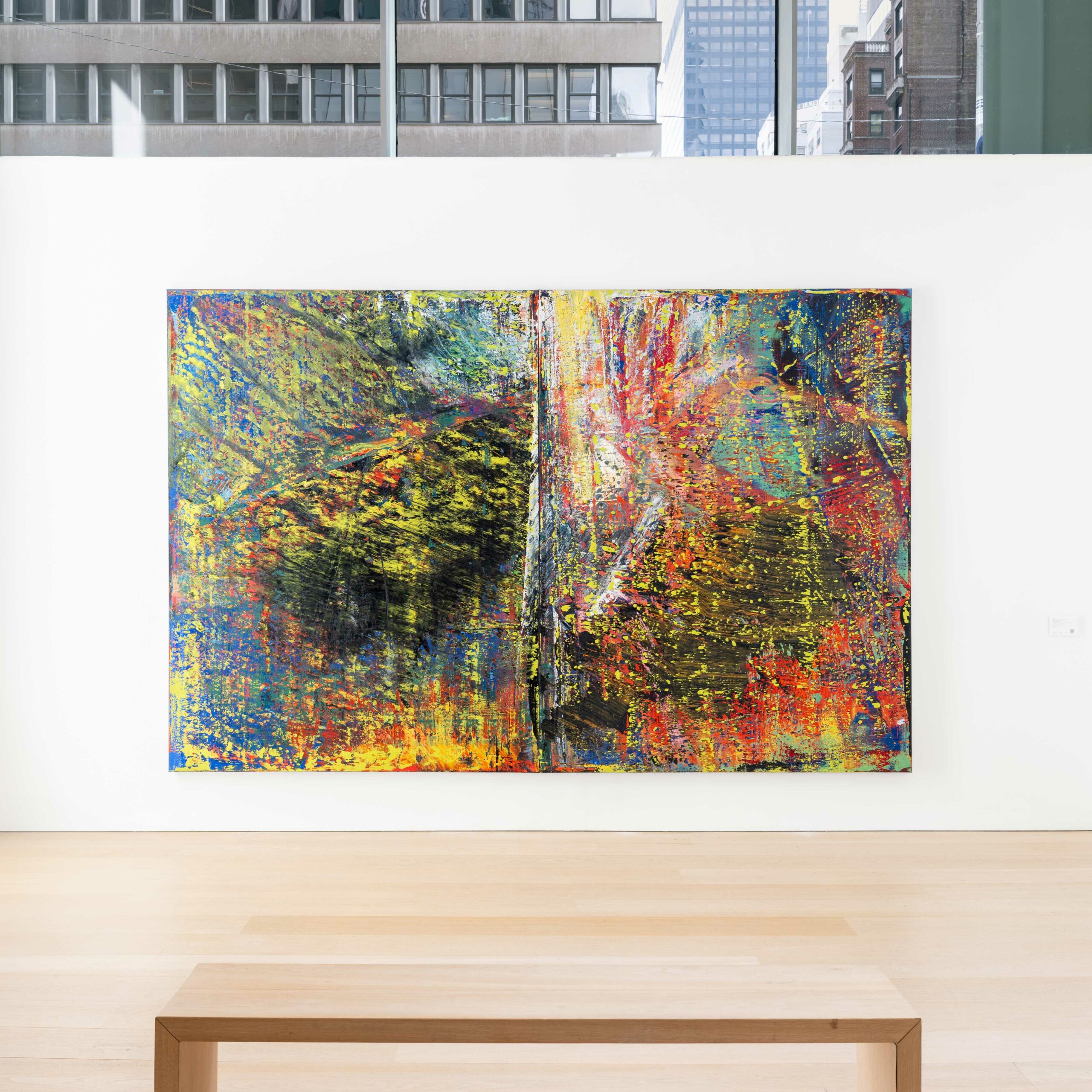 Exhibition view of a large abstract colorful painting by Gerard Richter.