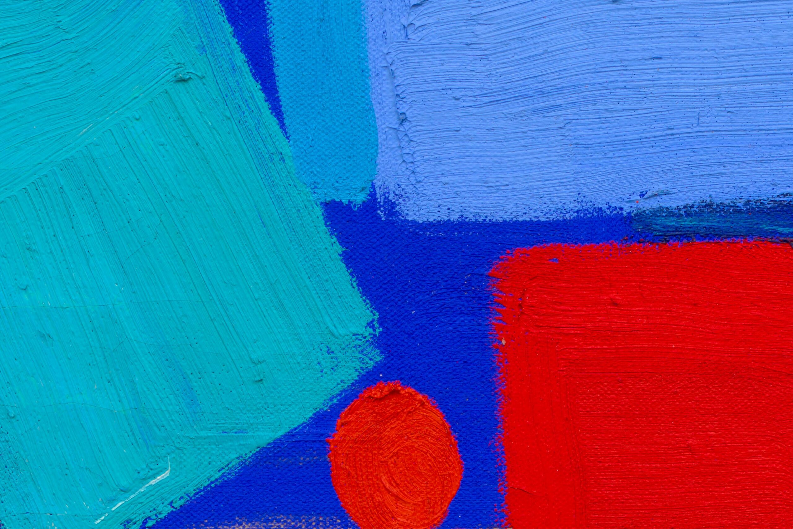 Detail of a painting with colorful red and blue brushstrokes.